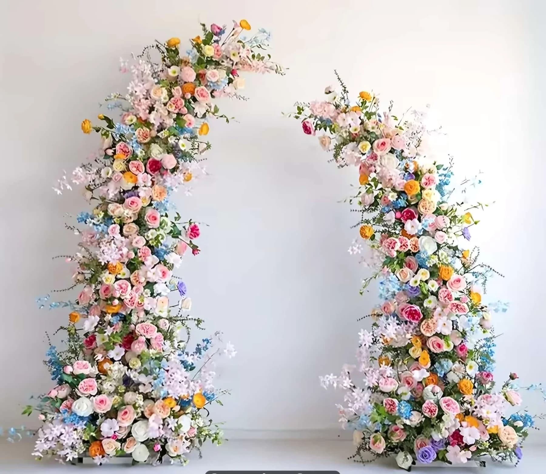 Garden-inspired floral arch for a celebration setup